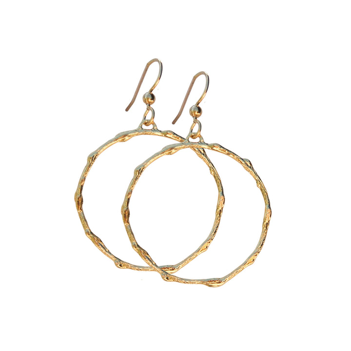 Round medium-sized gold Olive Branch Hoops with organic branch texture and ear hooks, handcrafted by Blooming Lotus Jewelry.