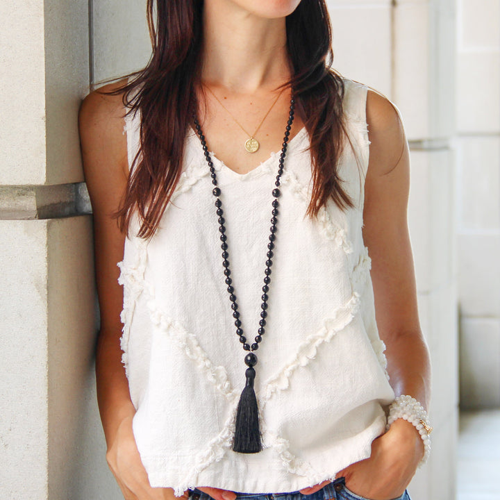 Eclipse Mala necklace front view on model with black tassel - Blooming Lotus Jewelry