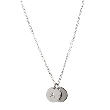 two tiny silver initial disc coin pendants hanging from chain - personalized hand-stamped