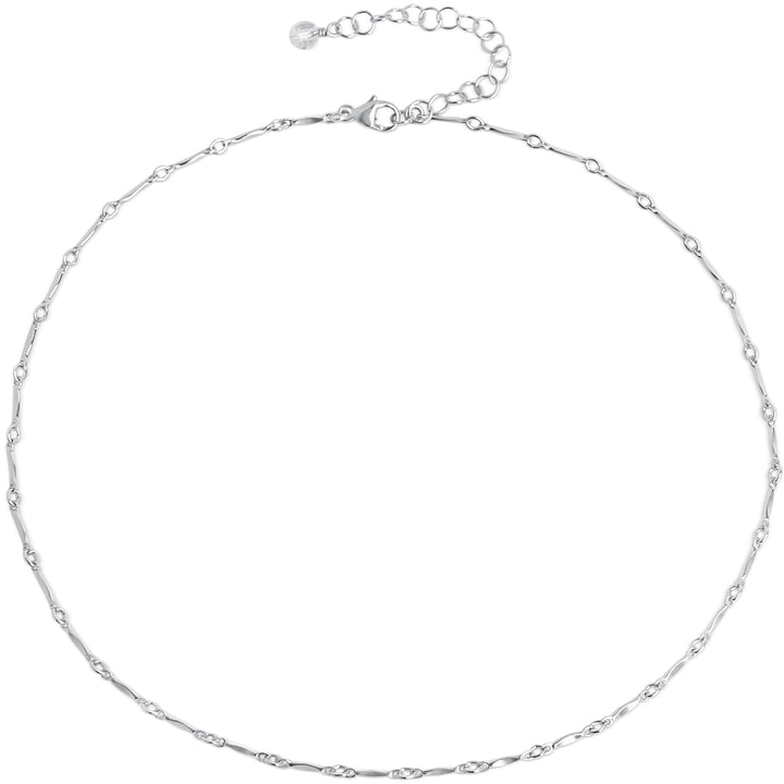 Delicate silver Twinkle choker necklace with minimalist chain links featuring tiny, twinkling details. The adjustable clasp and extender chain provide a customizable fit, making it perfect for layering or wearing solo.