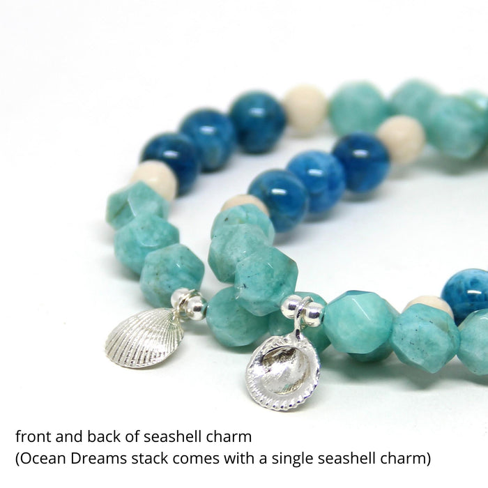close up of silver shell charms back and front on ocean gemstone bracelets