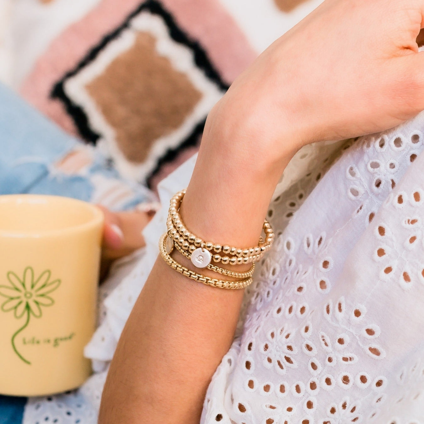 Gold Beaded Bracelets stack - stretch bracelets layered on model - Blooming Lotus Jewelry