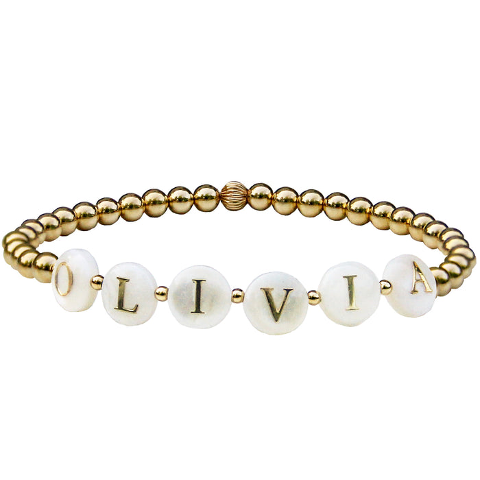Gold Beaded bracelet with white alphabet beads personalized with olivia