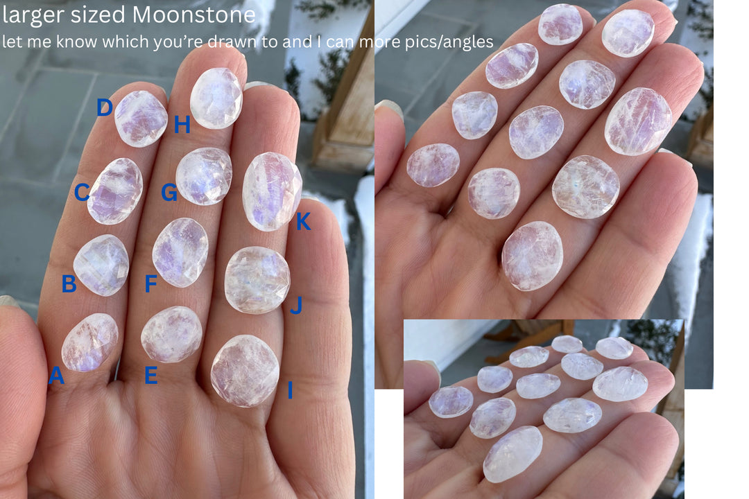 several one-of-a-kind rosecut Moonstone laying on fingers labeled A B C D E F G H I J K. 