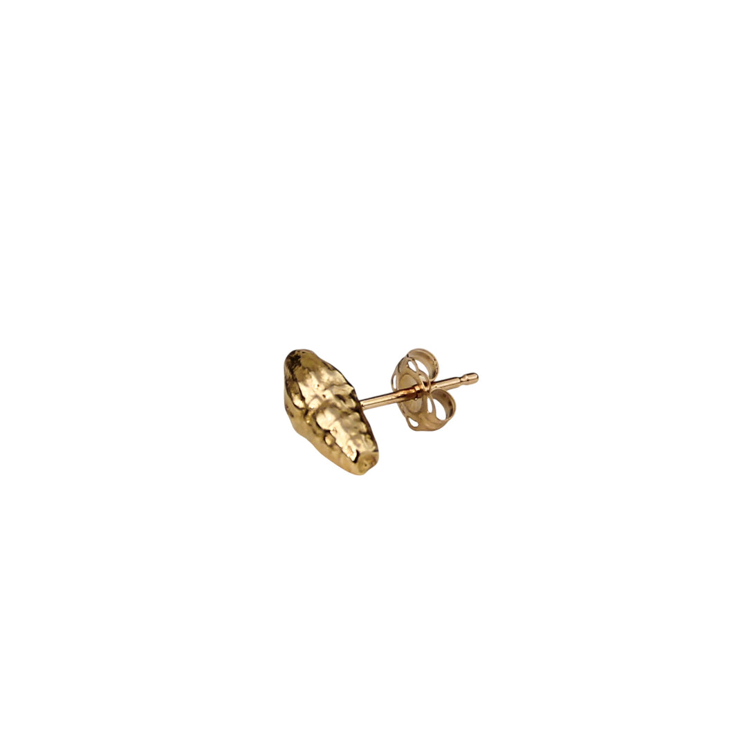 Single tiny gold shell stud earring shown from the side with post and backing, displayed on a white background.