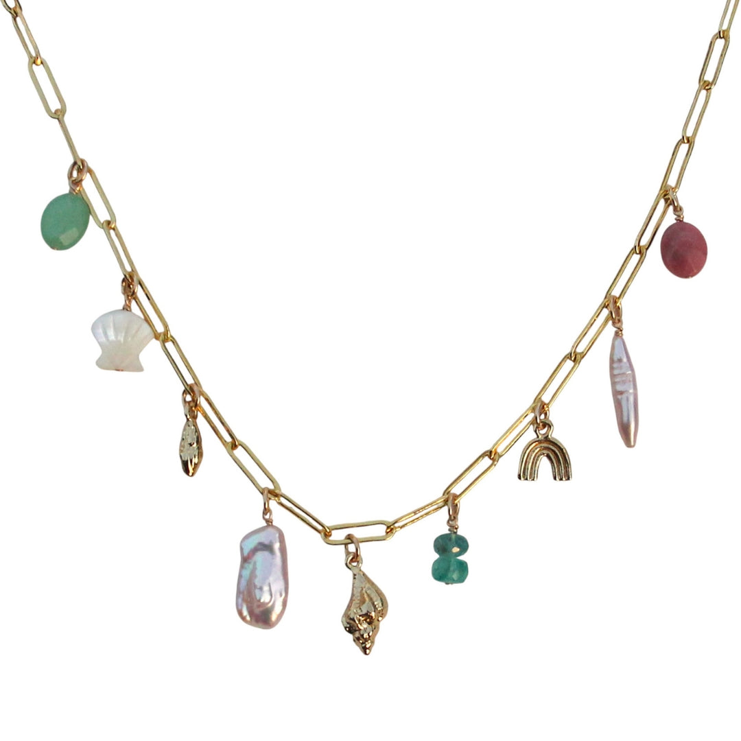 Gold custom charm necklace with mixed gemstones, pearls, and coastal-inspired charms on a paperclip chain from Blooming Lotus Jewelry. Charms include gemstones, shells, pearls, rainbow.