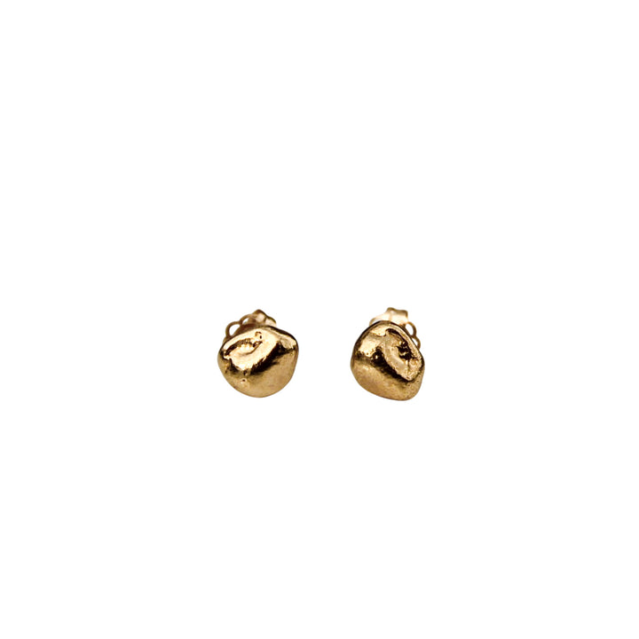 Tiny gold pebble stud earrings with an organic texture shown on a white background.