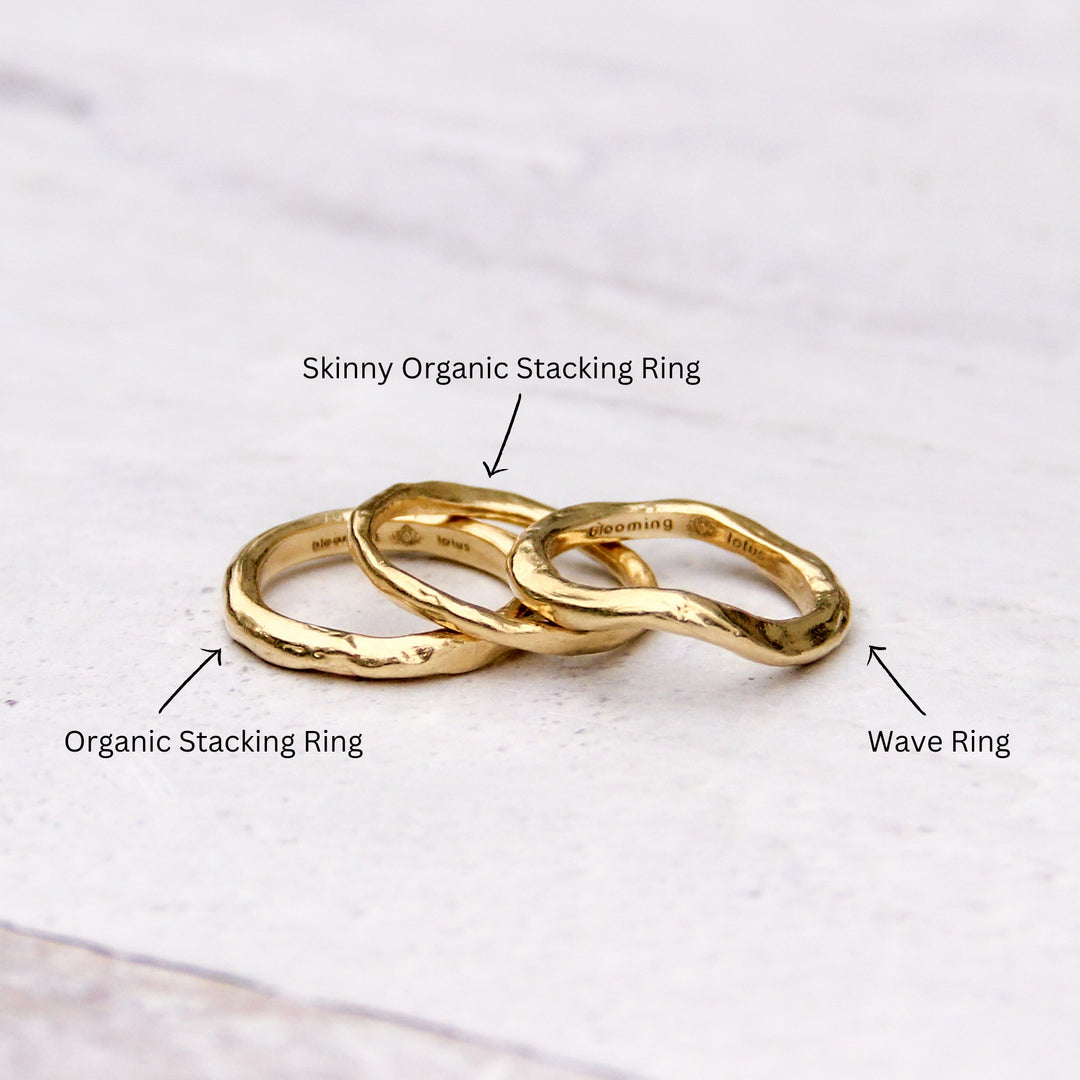 handcrafted 14k gold ring stack with labels identifying the Wave Ring, Organic Stacking Ring, and Skinny Organic Stacking Ring. 