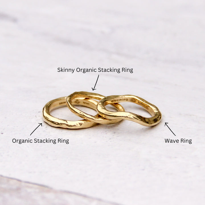 handcrafted 14k gold ring stack with labels identifying the Wave Ring, Organic Stacking Ring, and Skinny Organic Stacking Ring. 
