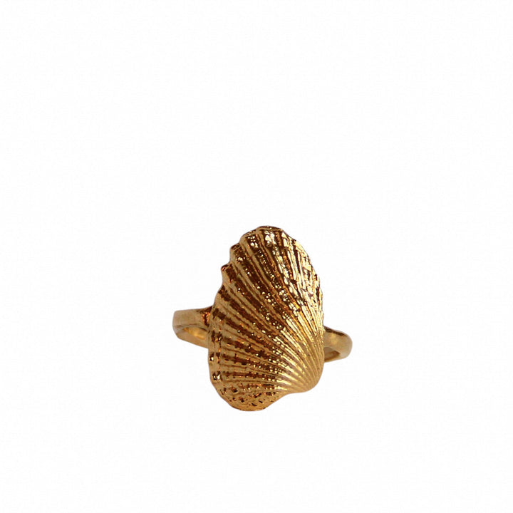 Gold shell ring cast from a real seashell, featuring organic texture and warm coastal tones, photographed on a white background by Blooming Lotus Jewelry