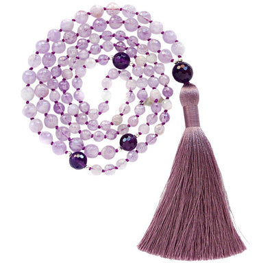 Amethyst mala beads with 3.5 inch purple tassel coiled up top view