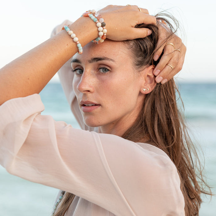 Stacking gemstone bracelets and stacking rings on model - Blooming Lotus Jewelry