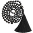 black onyx mala beads necklace with black 3.5 inch tassel coiled up top view - blooming lotus jewelry
