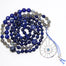Evil Eye Mala beads necklace with large silver pendant with topaz stone - lapis lazuli and labradorite mala beads - coiled up top view