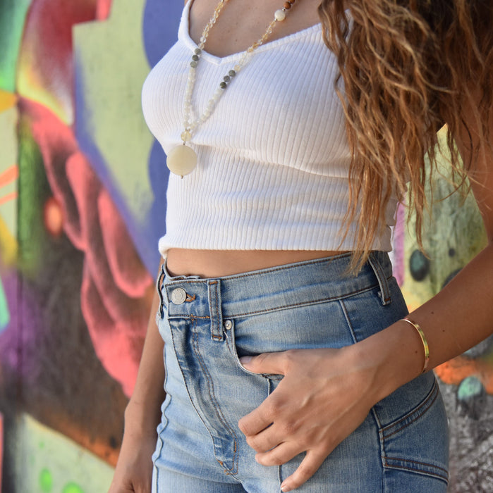 Full Moon gemstone mala necklace on model wearing white tank top and jeans - Blooming Lotus Jewelry
