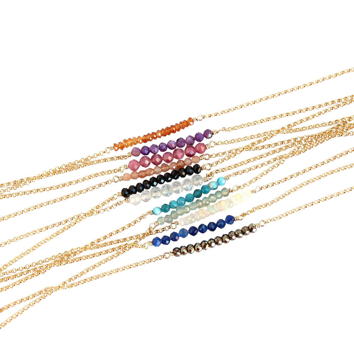 Gemstone balance bars on gold chain