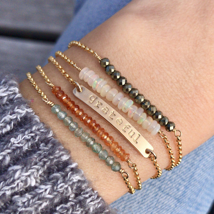 Gemstone Balance Bar Chain bracelets and grateful mantra bar close up on wrist - Blooming Lotus Jewelry