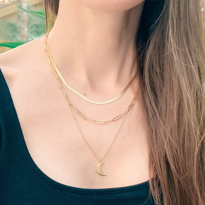 Model wearing gold layering necklaces - Paperclip, Herringbone, Luna Necklace Chains - Blooming Lotus Jewelry