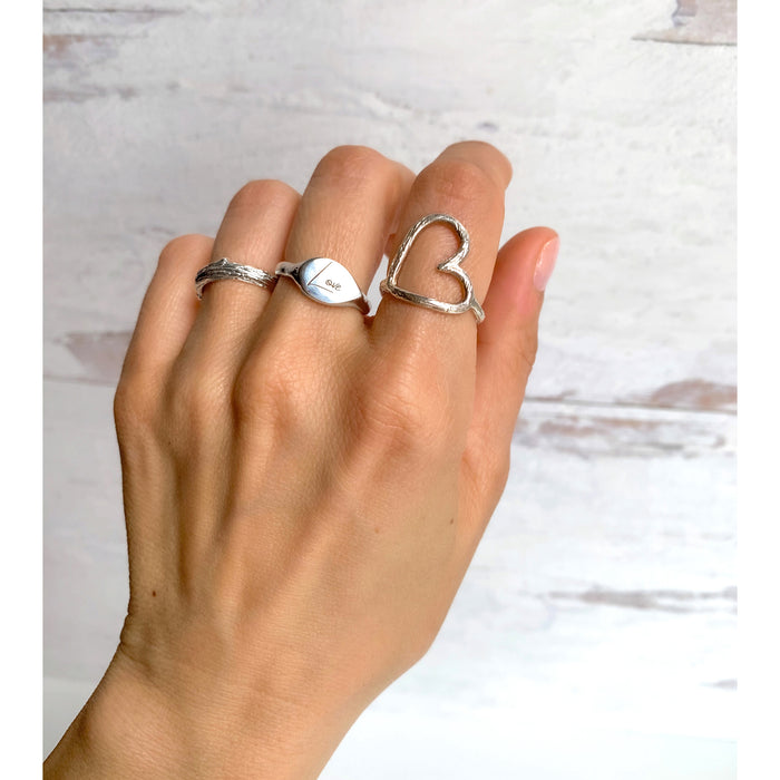 Sideways Heart Ring - Love Mantra - silver on hand - Blooming Lotus Jewelry