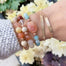 Mantra Bar Bracelet personalized with Breathe be mindful - beaded gemstone bracelets on wrist close up - Blooming Lotus Jewelry