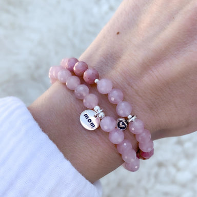 Rose Quartz gemstone bracelets with Mom Charm and Heart Charm close up on wrist - Blooming Lotus Jewelry