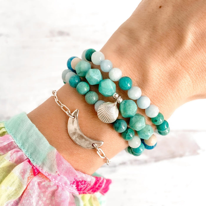 Ocean inspired gemstone bracelets with silver shell charm on wrist with silver crescent moon bracelet - Blooming Lotus Jewelry