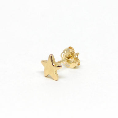 Tiny gold star stud earring single