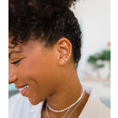 Tiny Arrow Stud Earrings Luna Crescent Moon Heart silver on model - Blooming Lotus Jewelry