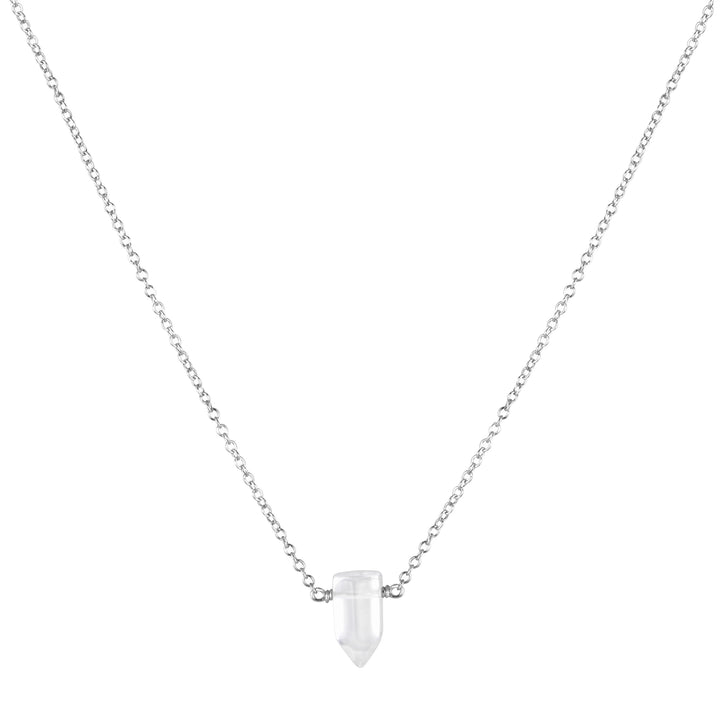 Sterling silver necklace featuring a tiny clear quartz crystal point on a delicate chain — minimalist healing crystal jewelry by Blooming Lotus Jewelry.
